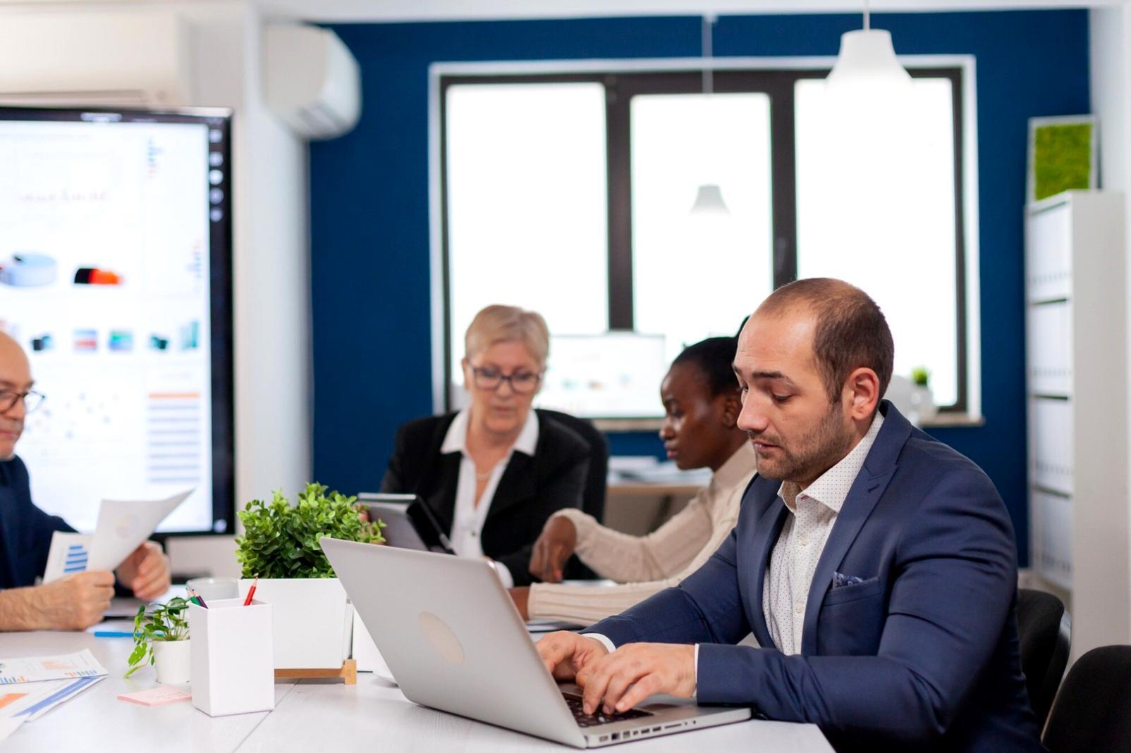 Business meeting with financial projections and strategic planning